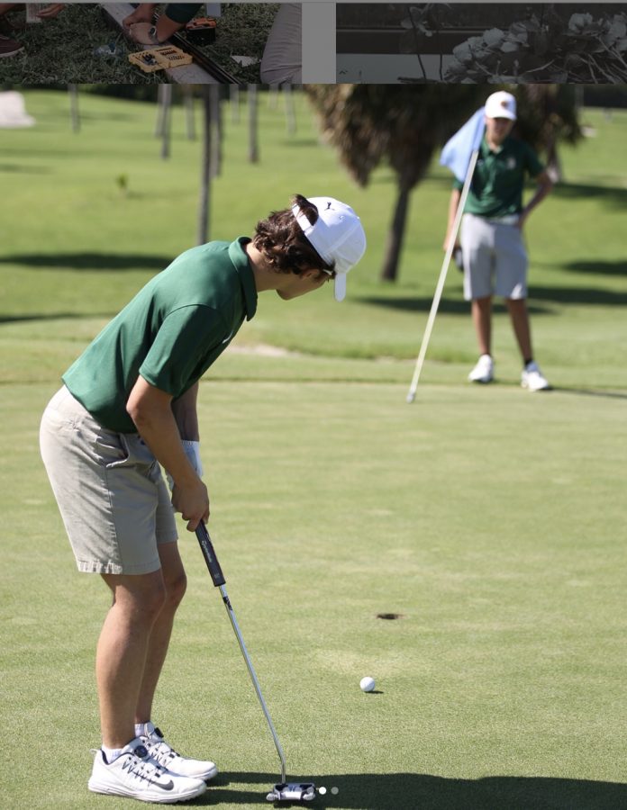 ILS golf team member readies for a putt. 