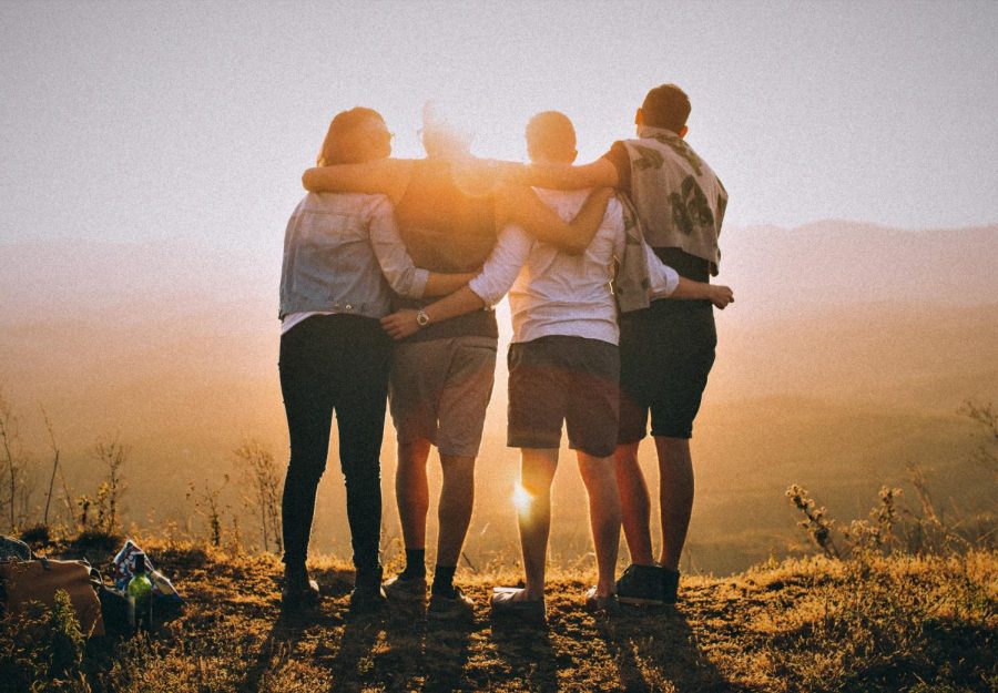 Friends embracing in a hug. 