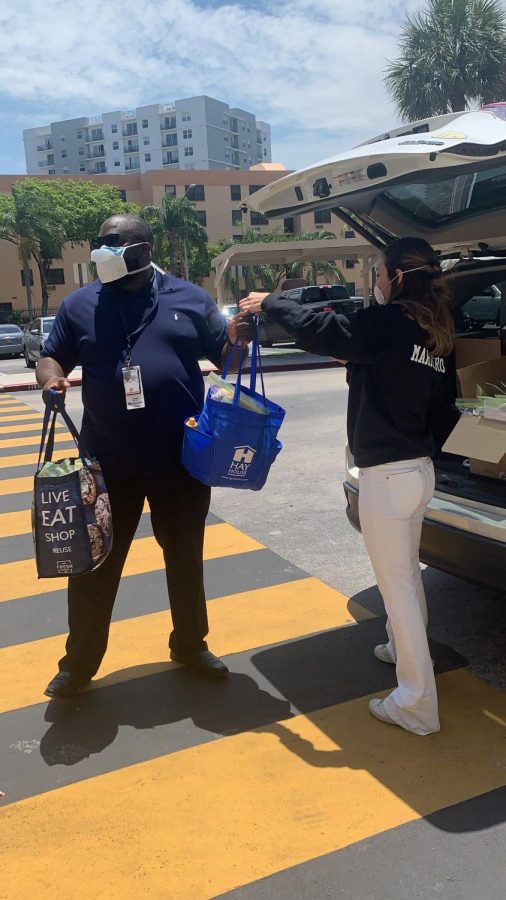 Junior Ana Marrero delivering food made by students to the Veterans Affairs Hospital.