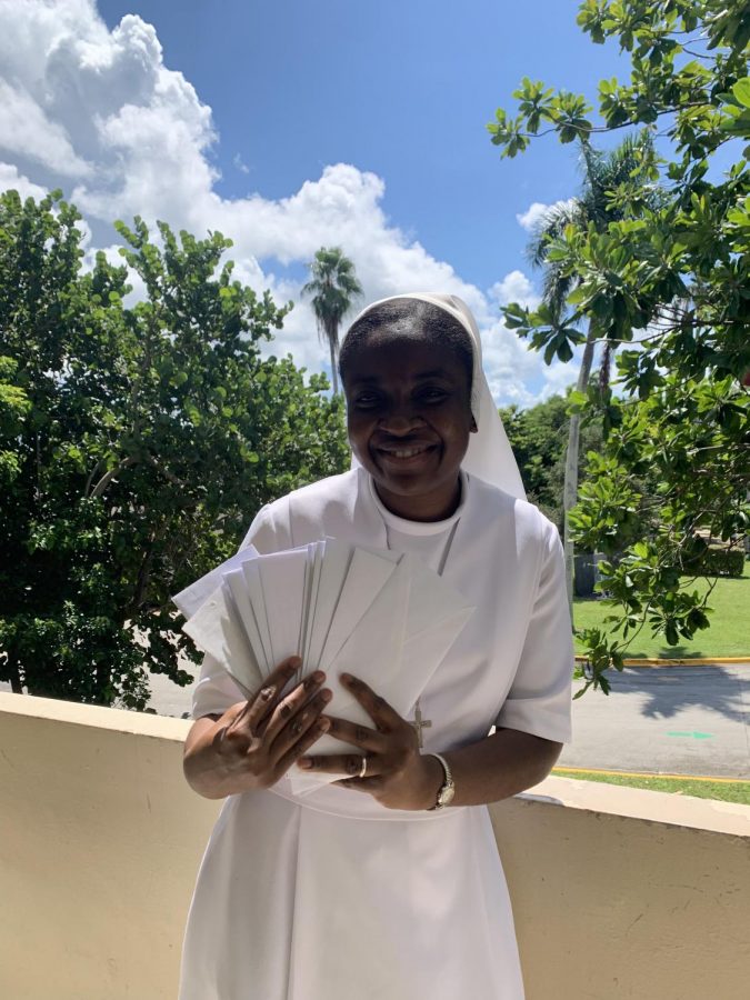 Sister Myriam Meus, holds “Letters to Future Me” activity envelopes. Originally from Haiti, Sister Myriam encouraged students to participate in the recent collection to serve survivors of the earthquake in her homeland.