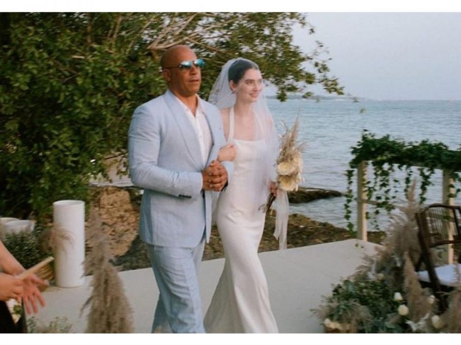 Vin Diesel escorts Meadow Walker at her wedding.