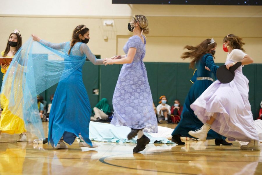 Some of the senior class girls dressed up as princesses in gowns and crowns performing in their Disney-themed class skit.