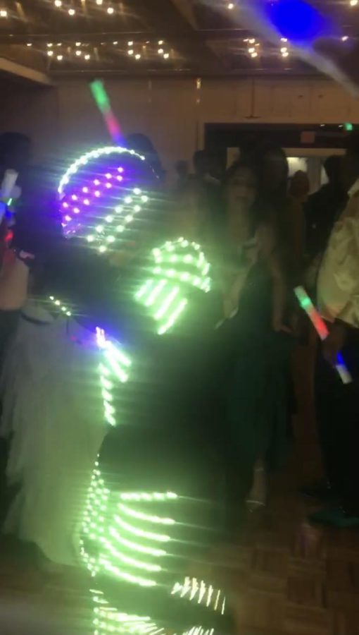 LED suited man dancing in the middle of the crowd at the 2019 Winter Formal