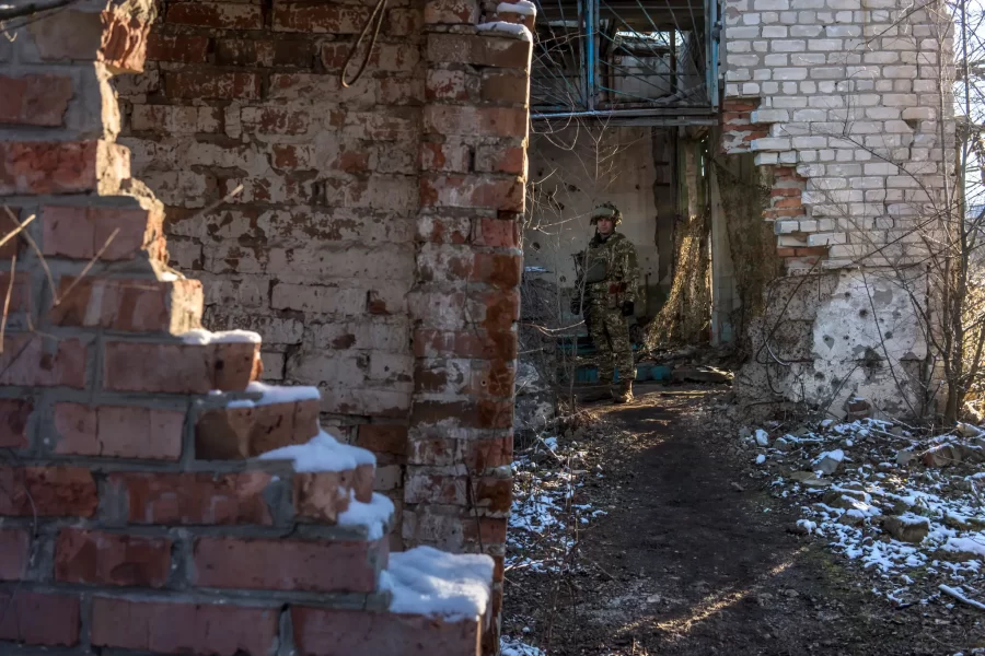 A Ukrainian soldier patrolling the front lines in Ukraine.