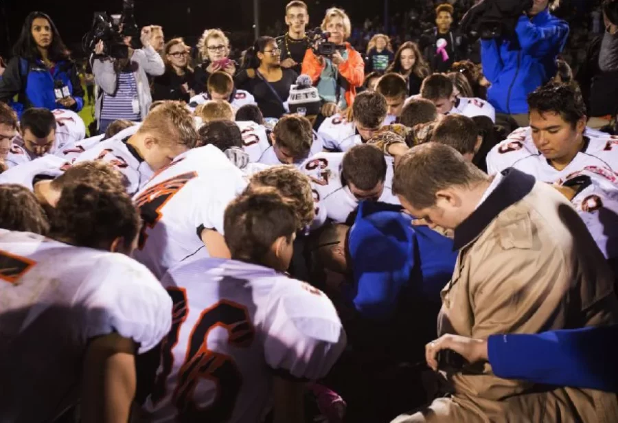 The parties included this image of Coach Kennedy, praying with the crowd after the homecoming game, in their joint appendix submitted to the Supreme Court.