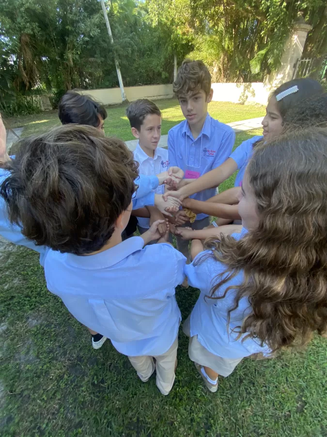 St. Rose Of Lima 7th graders form the human knot.