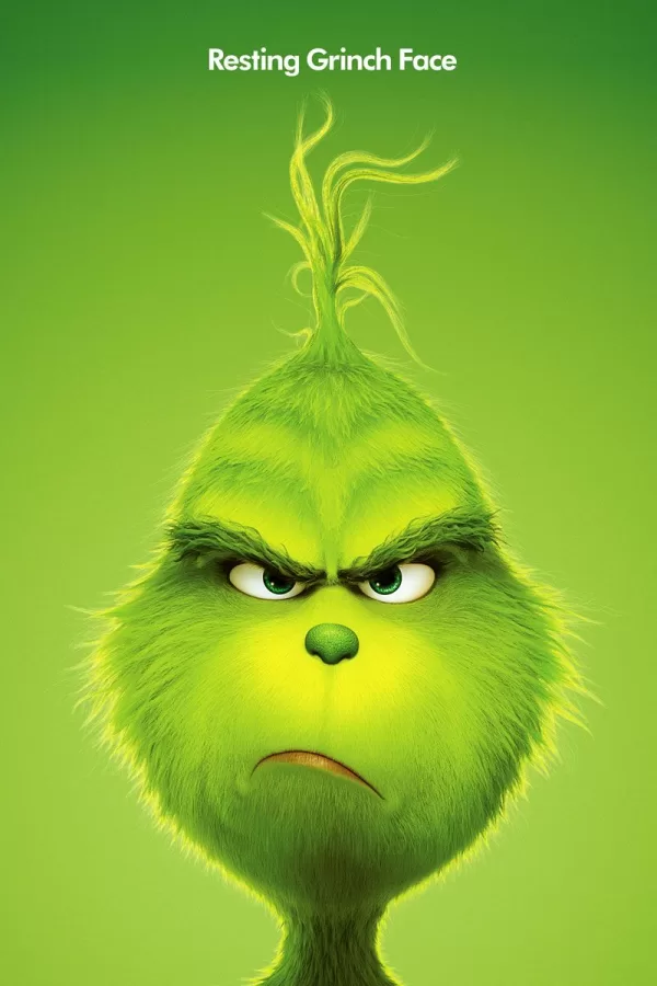 A poster for the animated  movie of the Grinch, with the Grinch being grumpy as usually 