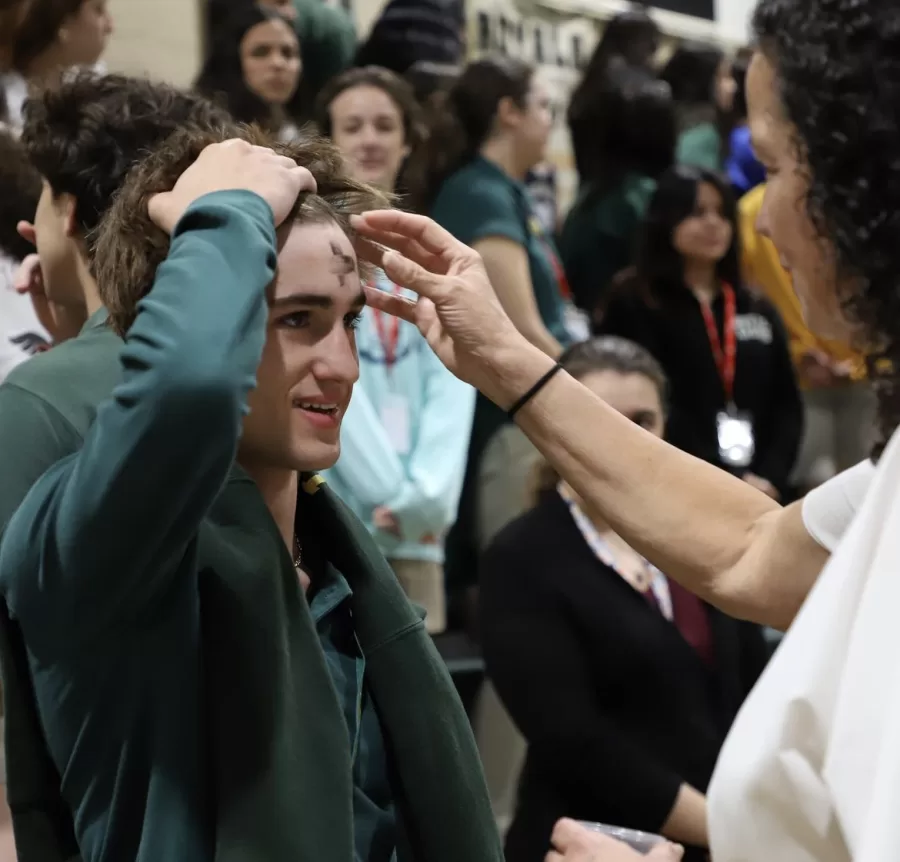 Senior Danny Riano receiving this ash for Ash Wednesday 
Taken by Sarah Henriques 