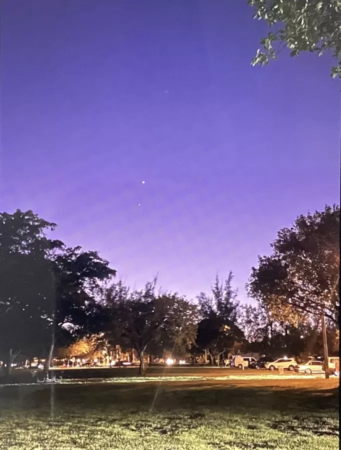 Venus and Jupiter nearly touching in the night sky at Tropical Park in Miami