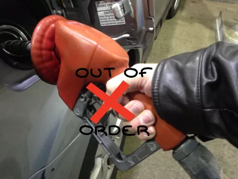A customer attempts to pump gas only to realize belatedly that there is no fuel available.