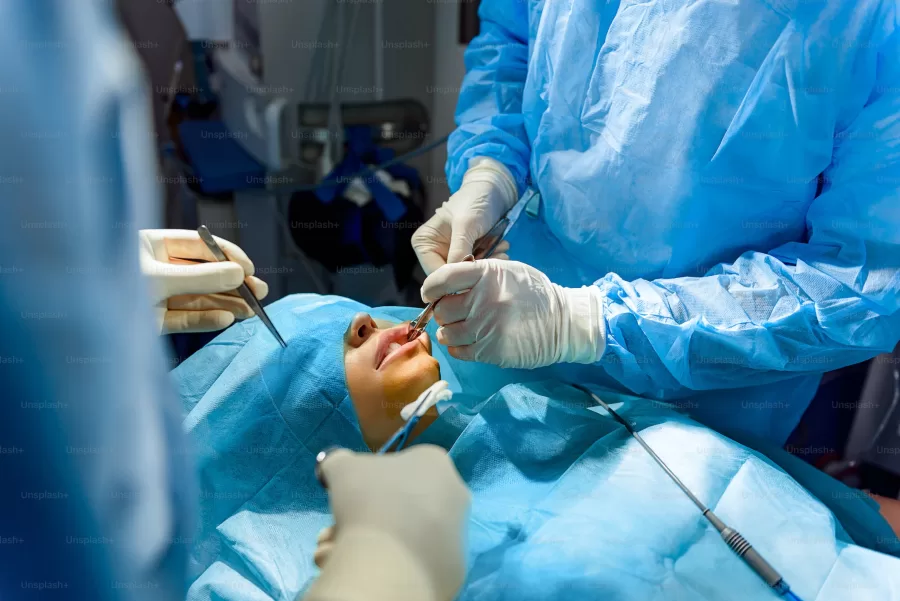 This image shows what its like to be in the operating room during a facial reconstruction.