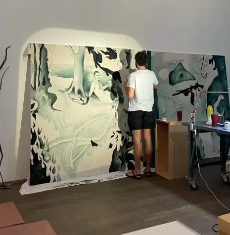 An artist paints in real time at the Perez Art Museum Miami, one of the many venues to explore this summer.