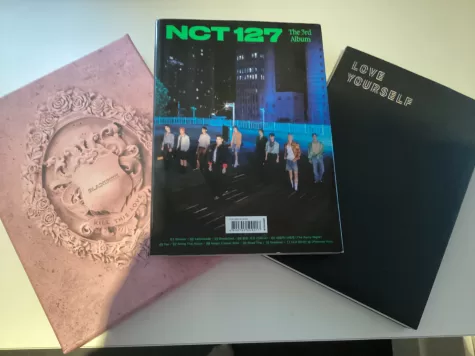 A picture collection of some of the K-pop albums I own including Black pink, NCT 127, and BTS.