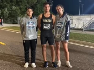 Emmanuel Roca is flanked by Candy Cruz and Mary Scheuerle at the University of North Florida.