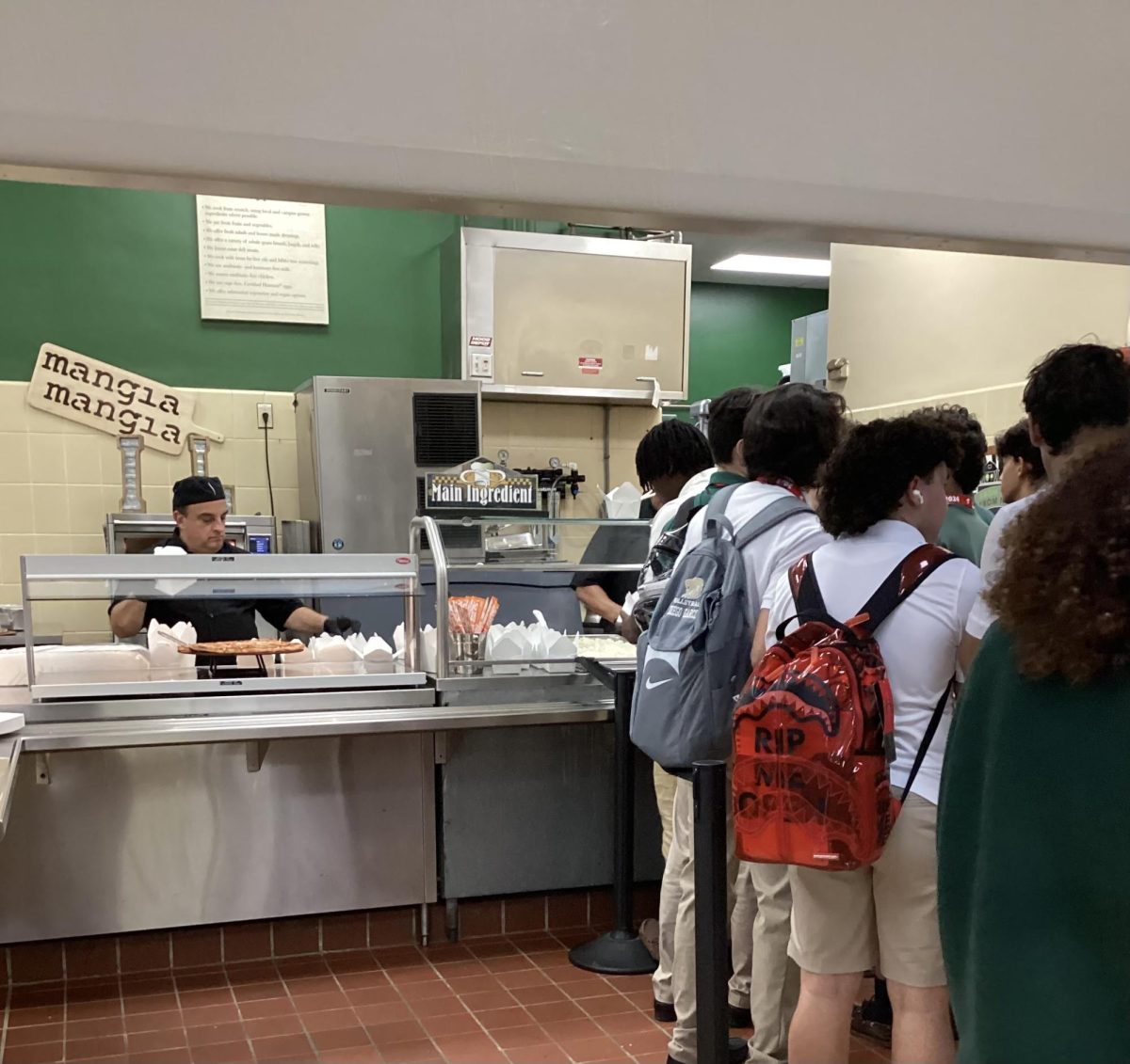 Students wait eagerly in the lunch line to be served another tasty meal courtesy of SAGE Dining.