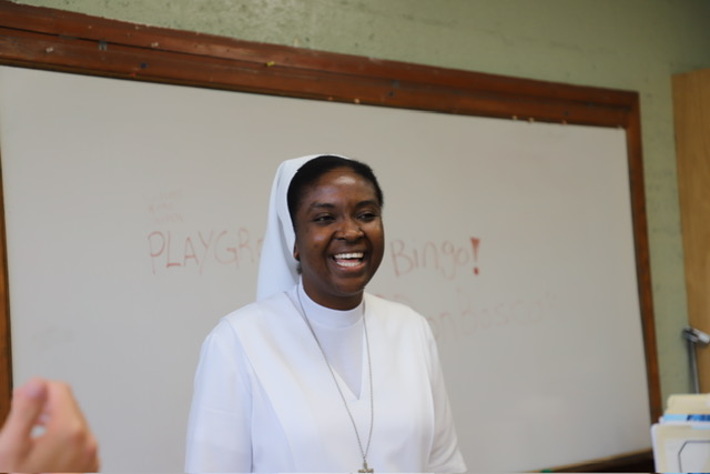 Sister Myriam Meus, FMA laughs while working alongside the children of Little Haiti.