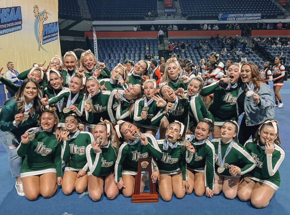 The ILS Royals Cheerleading team celebrate are winning the state championship last spring.