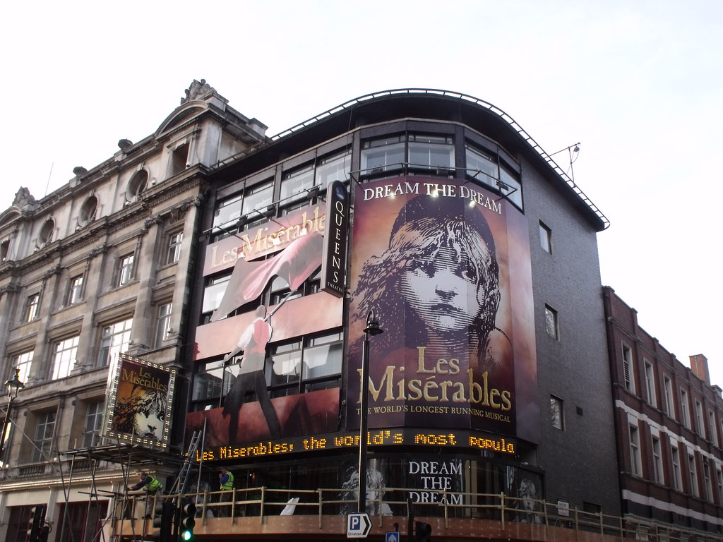 An image showcasing the Sondheim Theatre (previously the Queens Theatre) in London, where Les Misérables is currently playing. 