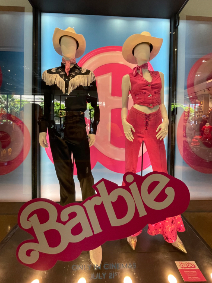 Barbie and Ken costumes on display from the Barbie movie at Warner Bros. Studio Tour Hollywood.