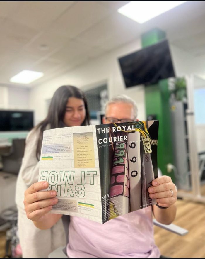 Co editor Ana Sophia Castillo and Mr Dean read newspaper together. 