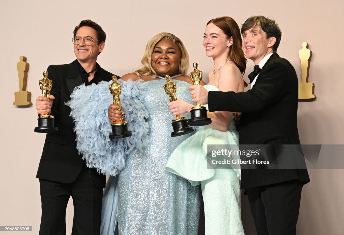The+Oppenheimer+cast+display+their+awards+to+the+cameras%2C+highlight+pride+in+their+work.+GettyImages%2FGilbert+Flores