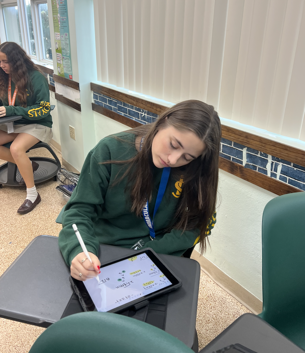 Senior Lucia Salazar stays on task by using her iPad not only to complete her work, but also as a calendar to keep track of her assignments.