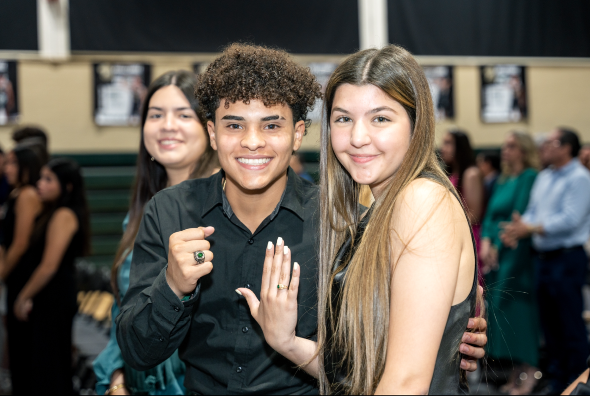 Juniors Alfredo Valle and Brecelis Valdes are proud of their new rings.