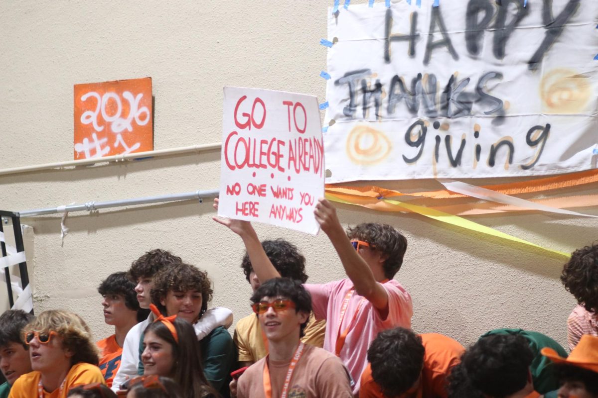 The sophomore class shows off their signs, displaying friendly competition to their fellow classmates 