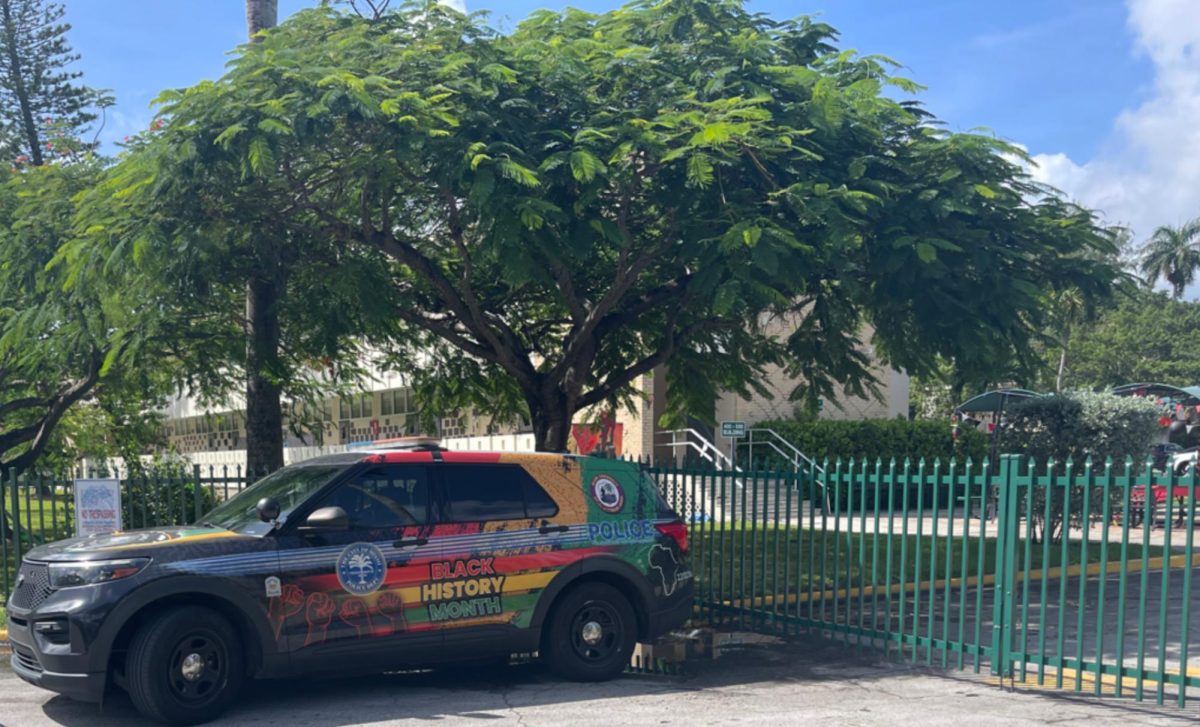 Just outside the 400 building gate, a City of Miami Police Department Vehicle outfitted to celebrate Black History Month reminds everyone of the reassuring presence of law enforcement.