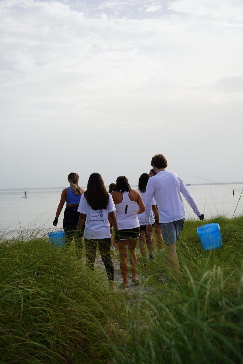 Senior Conrad Kolk and the members of his non-profit, KMLOEC, participate at a beach clean up. Photo: Conrad Kolk