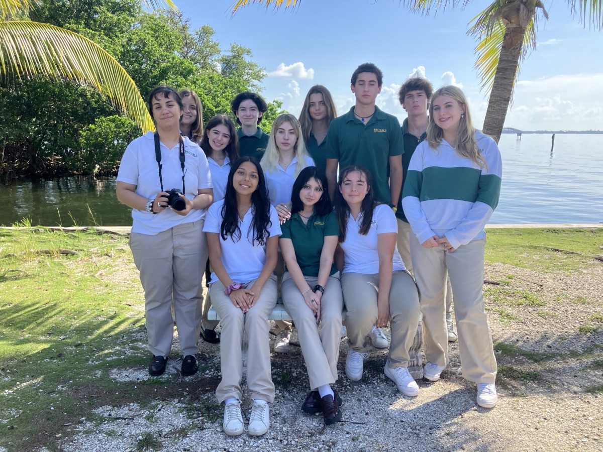 The members of ILS's iNklings literary magazine for 2024-2025 gather in front of the Bay lot.