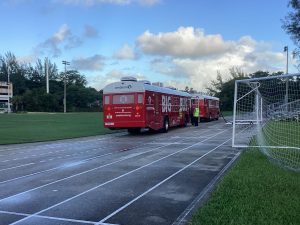 The Big Red Bus set up near the gym on the track course this past week to gather donations.