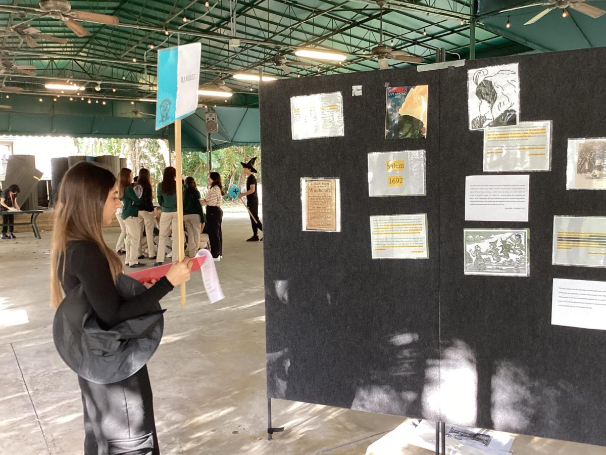 Junior escorts English class through crucible exposition displaying witchcraft through different modern media’s.