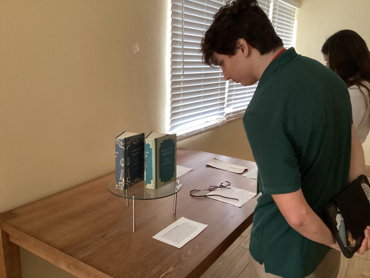 Observers admiring artifacts from the Crucible and times of the Salem witch trials. 