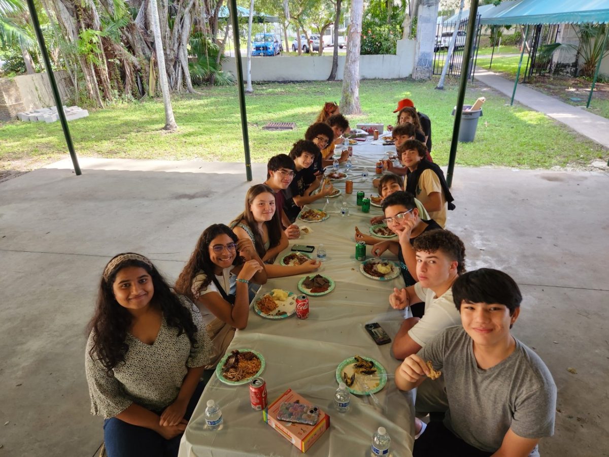 Band members share a meal and fellowship at the recent gathering.