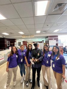 The Purple Hearts Club at a recent field trip to the Veterans' Administration Hospital. Members wore their purple club shirts to take their annual club photo for the school yearbook.