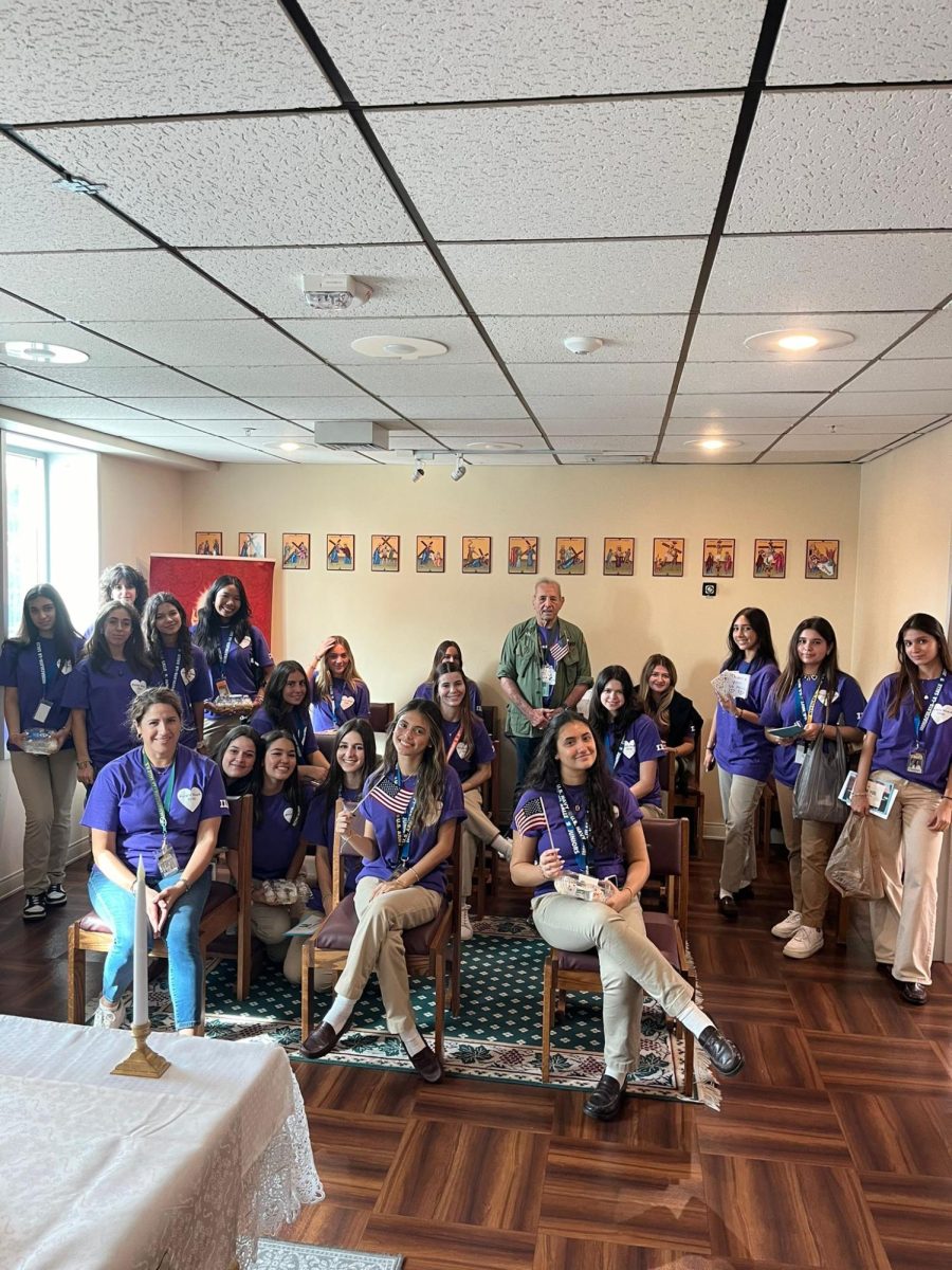 The Purple Hearts volunteers and advisers gather for a group photo during their annual excursion to visit the VA or Veterans Administration Hospital.