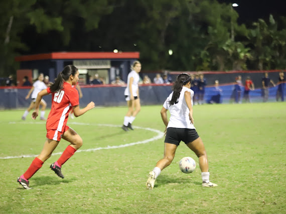 Varsity Girls' Soccer player and senior, Valentina Mangles, attacks a player from Florida Christian. ILS won the game 10-2.