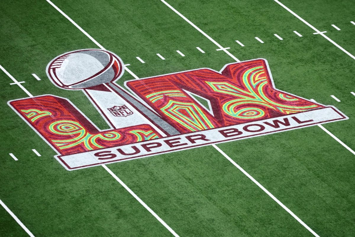 The LIX Super Bowl logo is displayed on the field of the Caesars' Superdome in New Orleans.