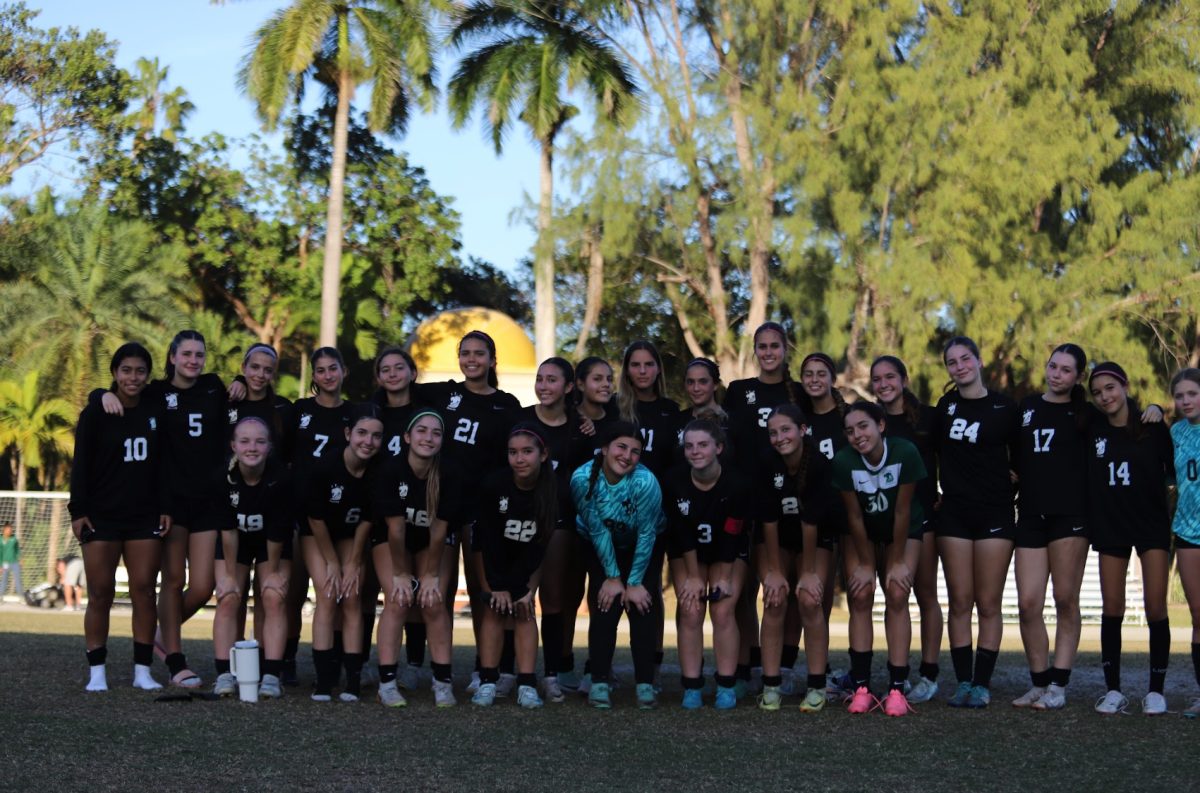 ILS Girls Soccer team gather for a group photo after winning semi finals against Somerset Palms. 