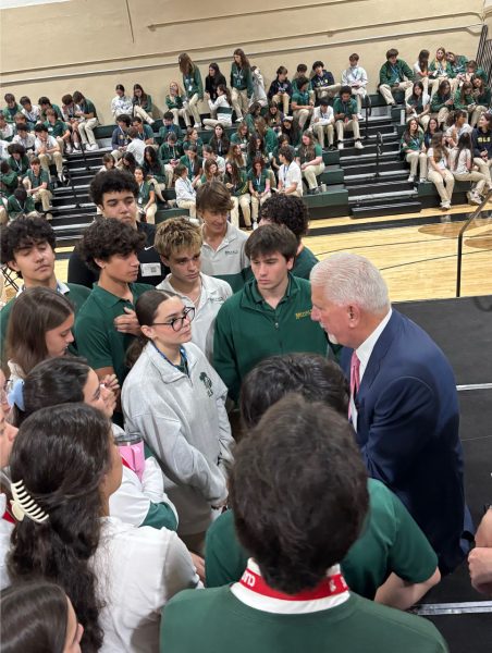 Students gather around Mr. Rodney Barreto to ask him questions and gain valuable advice from him. 