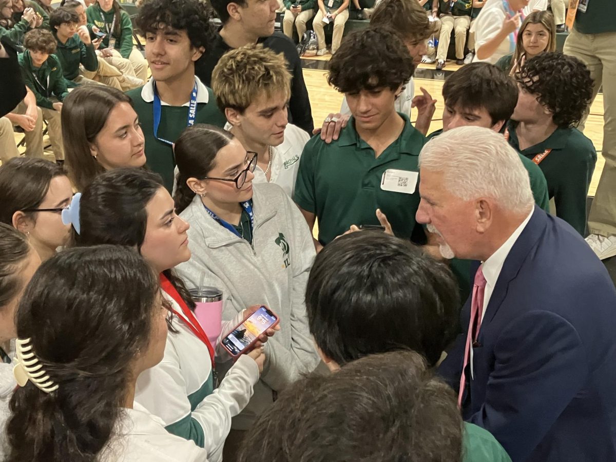 ILS illustrious alum, Mr. Rodney Barreto, fields questions from students including senior Martina Ottolina (holding a cellphone) regarding the possibility of working for Florida Fish and Wildlife where he serves as chairperson.
