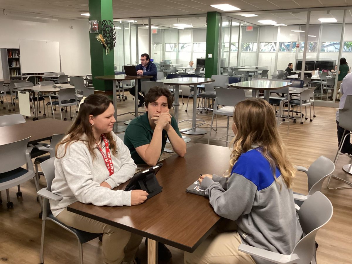 Seniors Katerina Garcia, Miguel Suarez-Cabal, and Gianna Ferrara convene to discuss Super Bowl LIX on a recent Royal Courier podcast. 