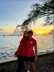 Seniors Valentina Lanza and Gabriel Ferrer enjoy each other's company observing the sunrise over Biscayne Bay.