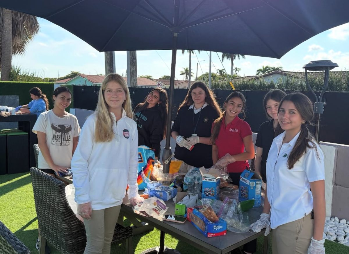 Volunteers of VIP 305 gather to pack sandwiches for the homeless.