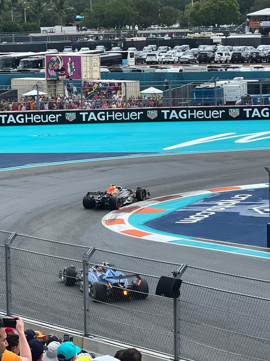 Atlassian Williams Racing driver Carlos Sainz chasing down Oracle Red Bull Racing driver Yuki Tsunoda.