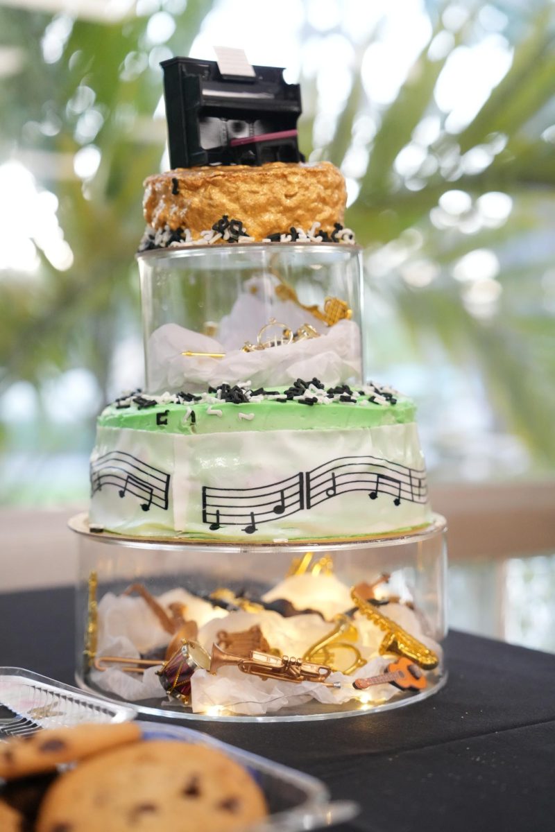 A cake that shows the musical aspect the of the band brought in by some of the parents present.