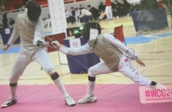 In this photo, junior Adrian Suarez, on the right, competes at a tournament in Sweden.