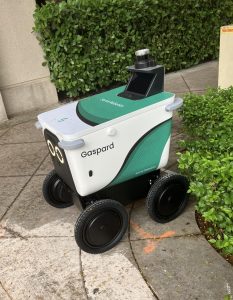 A Serve Robotics delivery robot named Gaspard rolls through Coral Gables, one of the Miami neighborhoods where food robots have become a common sight.