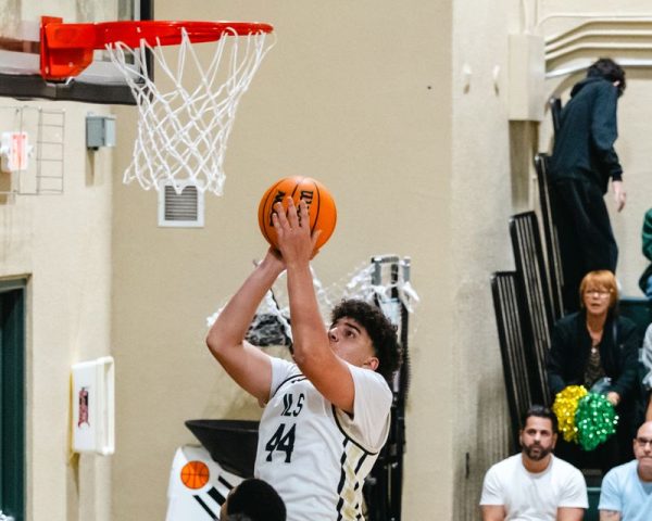 ILS boys basketball team senior hits 2 points for the royal lions. 